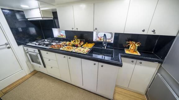 Fully equipped kitchen with delicious dishes on Gulet Golden Glory.