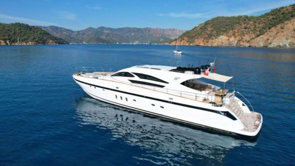 Luxurious motor yacht Goldfinger off the scenic coast of Athens, Greece.