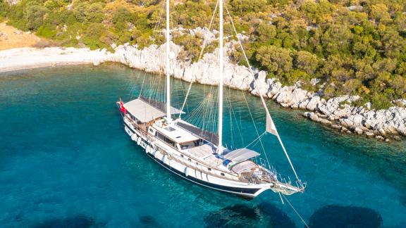 Aerial view of the 24-meter long gulet Grand Sailor anchored in the waters of Fethiye, Turkey.