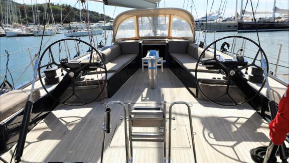 Spacious cockpit area of the Grand Soleil 58 Morfely sailing yacht in a marina in Sardinia, Italy. Ideal for yacht chart