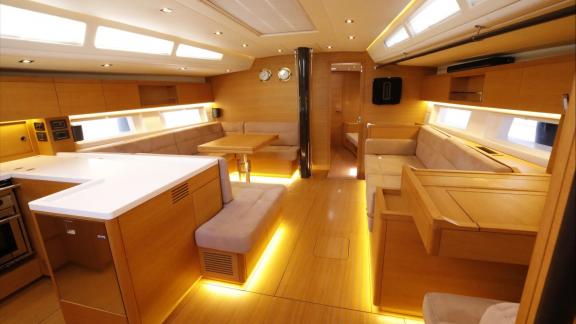 Bright saloon of the Grand Soleil 58 Morfely sailing yacht in a marina in Sardinia, Italy. Designed for comfortable Medi