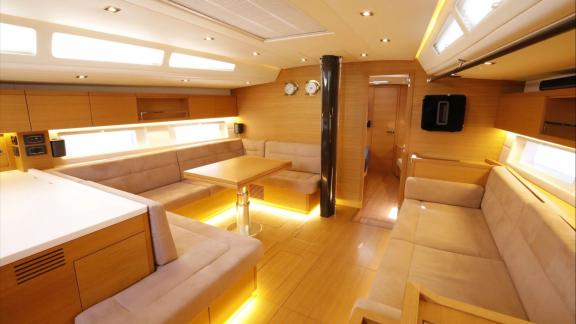 Spacious saloon of the Grand Soleil 58 Morfely sailing yacht in Sardinia, Italy. Designed for comfortable sea holidays.