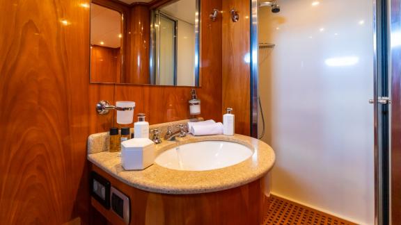 Olbia yacht charter offers a luxurious experience in the stylish bathroom of the Shangra motor yacht.