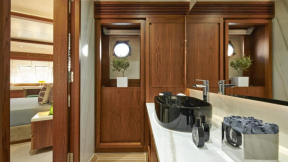 Elegant bathroom with luxurious fittings and wood details on motor yacht La Fenice.