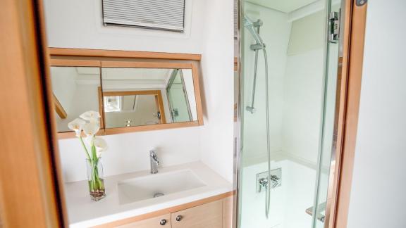 Stylish and well-equipped bathroom on Catamaran Lucky Clover with spacious shower and elegant design.