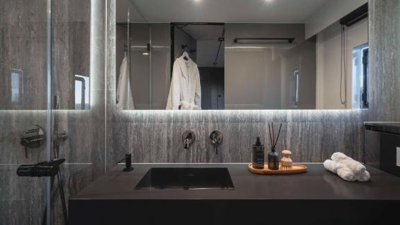 Stylish bathroom with elegant lighting and high-quality fixtures on the Catamaran Alteya.