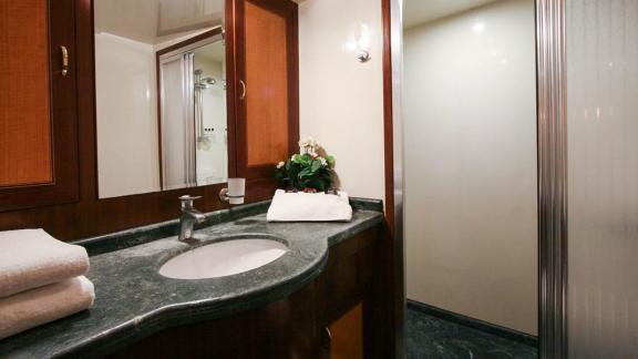 Elegant bathroom with high-quality fixtures and shower on a yacht in Bodrum.