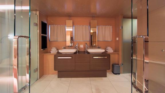 Modern bathroom on Omnia with two sinks and stylish design.