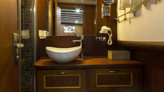 Elegant bathroom of the Gulet Smyrna with modern equipment and stylish design.