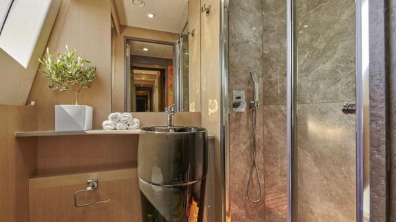 Modern bathroom with luxurious shower and stylish sink on motor yacht La Fenice.