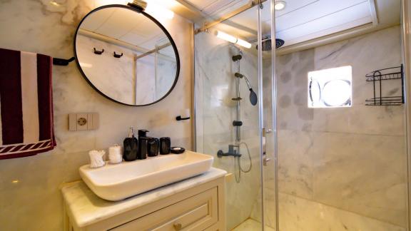 The elegant bathroom of the Gulet Caustic in Bodrum, equipped with modern amenities.