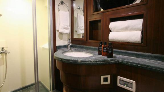 Elegant bathroom with shower and high-quality fixtures on a yacht in Bodrum.