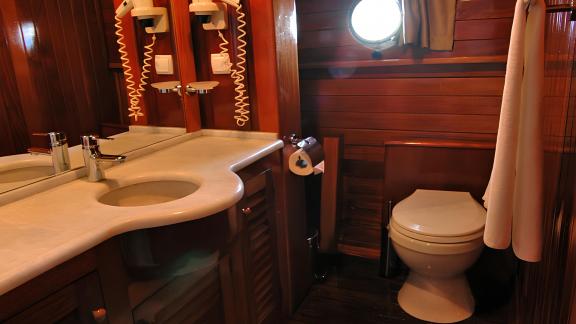 Well-equipped bathroom on the Sunworld 8 with mirror, sink, and toilet.