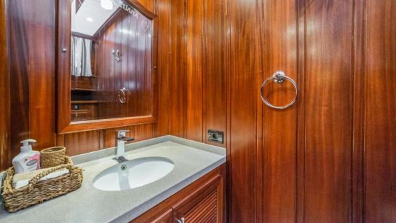 Beautiful washbasin with modern fittings and wood panelling on a luxurious gulet in Bodrum.