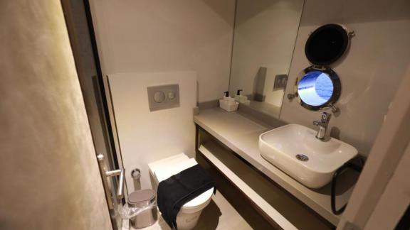 Modern bathroom on the trawler Nayk 3 features a stylish and minimalist design.