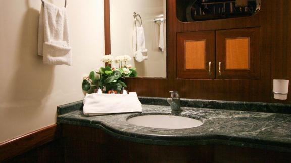 Stylish guest bathroom with high-quality fixtures on a yacht in Bodrum.