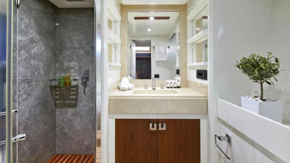 Luxurious bathroom with spacious shower and stylish sink on motor yacht La Fenice.