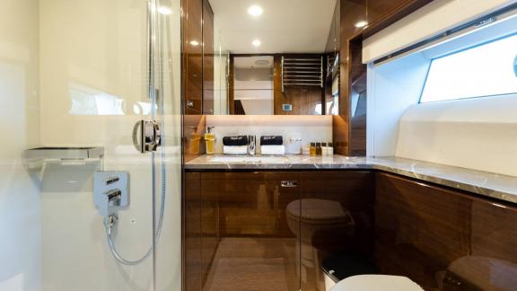 Modern bathroom with glass shower and elegant fixtures.