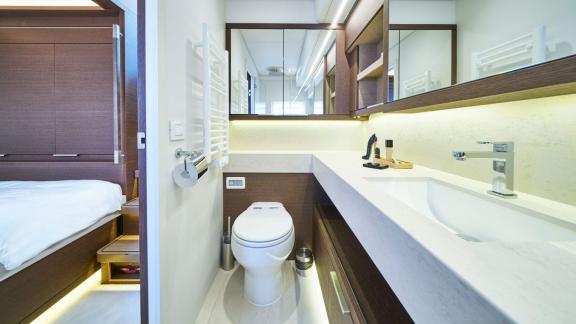 Elegant ensuite bathroom with modern amenities and direct access to the cabin on Lagoon Seventy 7.