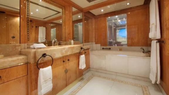 The spacious and elegant bathroom on Code 8 yacht enhances your Dubai motor yacht rental experience.