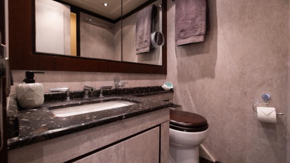 The bathroom on motor yacht Five Stars offers stylish design and modern amenities for comfort.