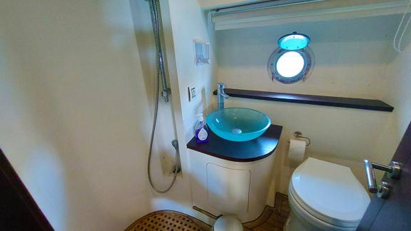 The modern bathroom of motor yacht Germanor is equipped with a stylish sink and a comfortable shower area.