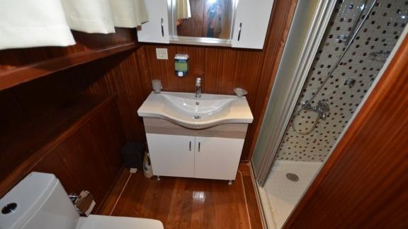 Stylish bathroom with shower on Gulet Miss Vela in Marmaris. Comfort and cleanliness guaranteed.