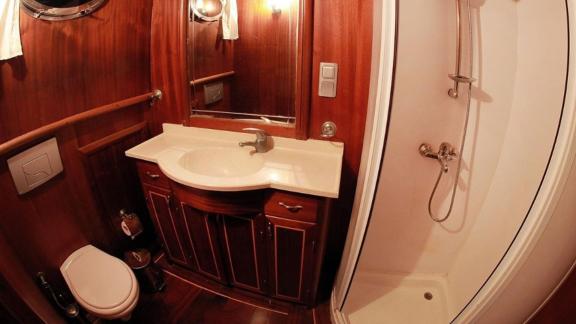 Stylish bathroom with shower and wooden decor on Gulet Galip Nur