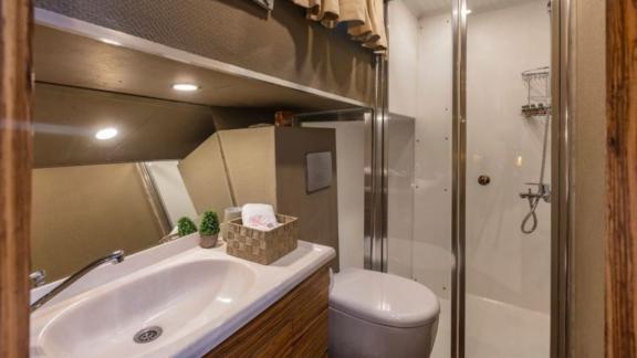 This stylish bathroom features a spacious shower, modern amenities, and elegant design.