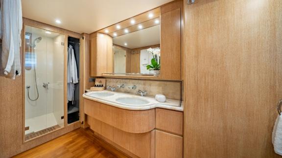 The spacious bathroom of Opera yacht stands out with modern design and luxurious details.