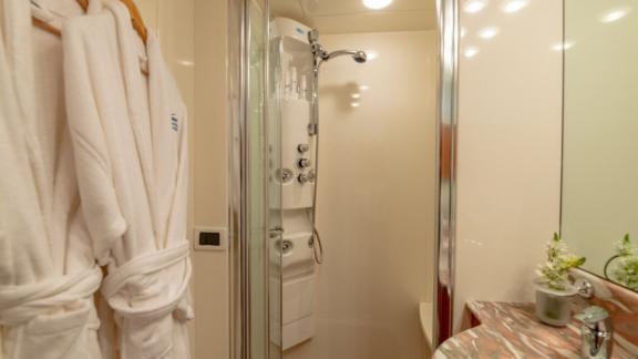 The luxurious bathroom of the Venus Secrets yacht features a modern shower cabin and elegant details.