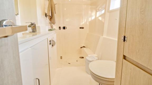 Bright and well-equipped bathroom on the Leopard 48 Monaco, offering comfort and convenience on your journey