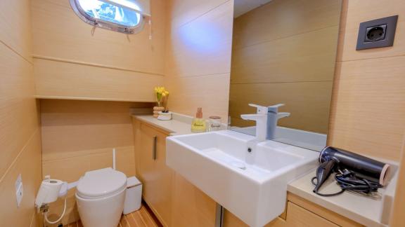 Modern bathroom of the 3-cabin Gulet Limonata in Göcek, Turkey, with stylish amenities.