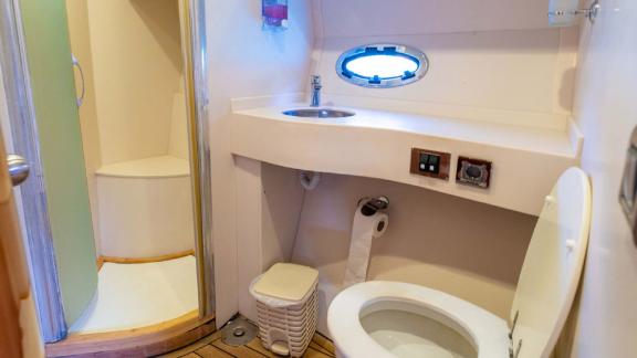 The spacious bathroom on motor yacht Selenge offers comfortable use with modern fixtures and clean lines.