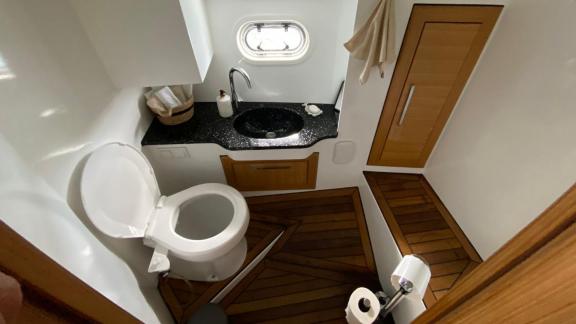 Modern bathroom on the yacht Labarna with stylish design and sea-view window.