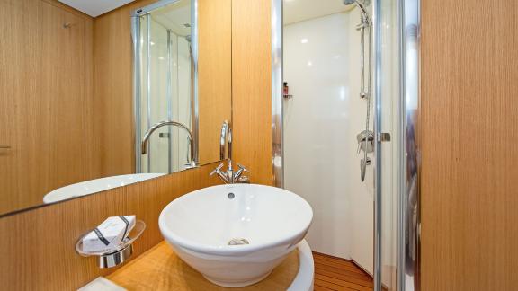 Modern bathroom on Alegria with stylish fixtures and a comfortable shower.