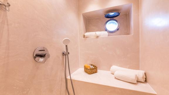 The shower area on the Floki trawler yacht has a stylish and functional design.