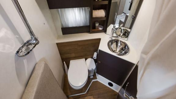 The modern bathroom on motor yacht Brown Sugar features a stylish and functional design.