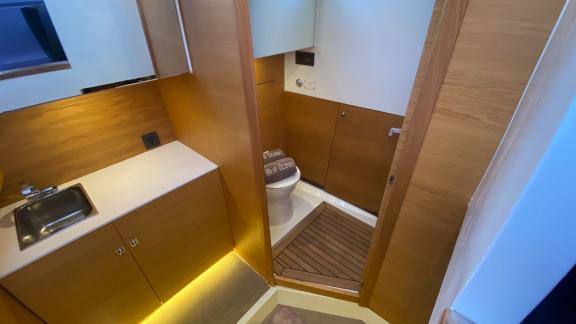 The modern bathroom of motor yacht Cea 3 features an elegant and functional design with wooden accents.