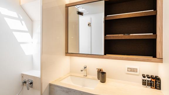 The bathroom of White Caps features a minimalist design with elegant details.