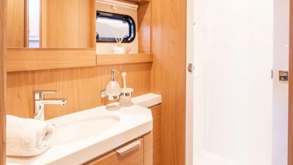 Stylish and functional bathroom with modern design on the Sahana catamaran.