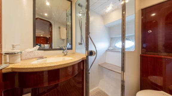 The spacious bathroom of the yacht Make My Day features stylish design and modern amenities.