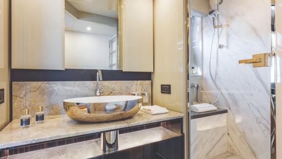 The luxurious bathroom on Emilia 2 features elegant marble details and a refined design.