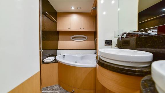 Luxurious bathroom with jacuzzi on yacht Stela 117 offers comfort.