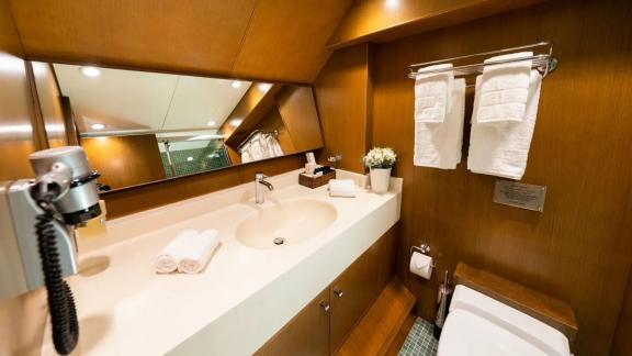 Stylish en-suite bathroom on gulet Arktos, equipped with modern amenities.