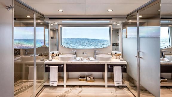 The bathroom of Dolce Vita features double sinks and a panoramic sea view.