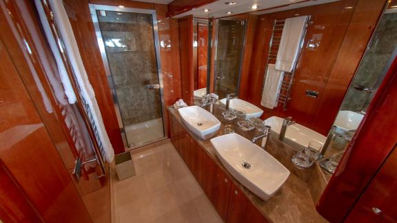 The stylish and modern bathroom of the Notorious motor yacht enhances your Dubai yacht rental experience with luxury and