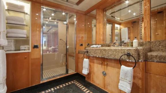 The modern bathroom on Code 8 yacht elevates your Dubai luxury yacht rental experience.