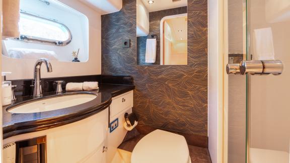 Ehthele yacht’s bathroom features elegant details and a window for natural light.