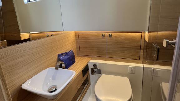 Stylish washbasin area of the Bambino motor yacht available for charter in Ibiza.